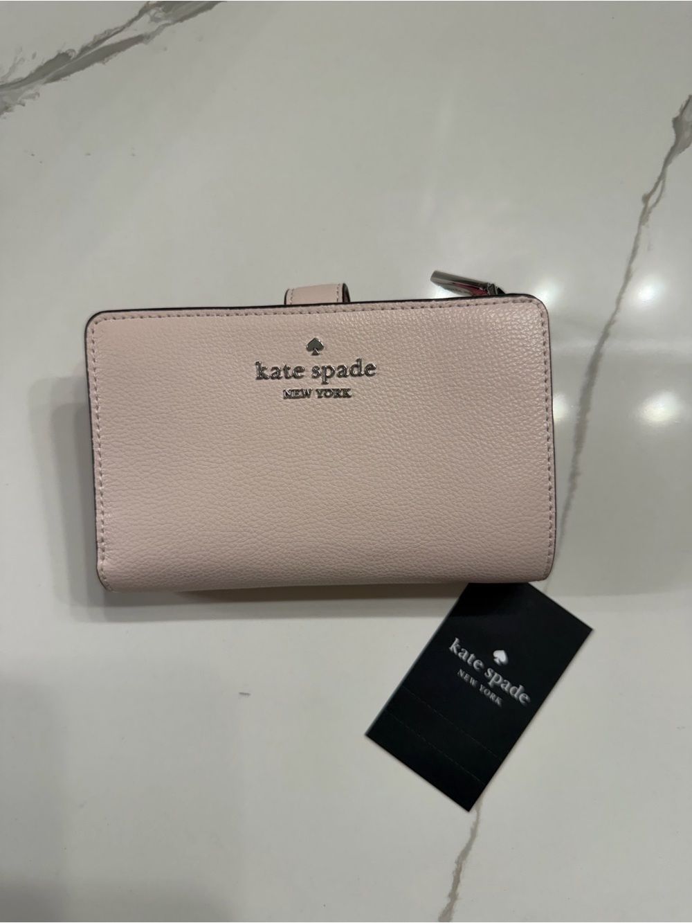 kate spade light pink leather wallet with silver hardware
